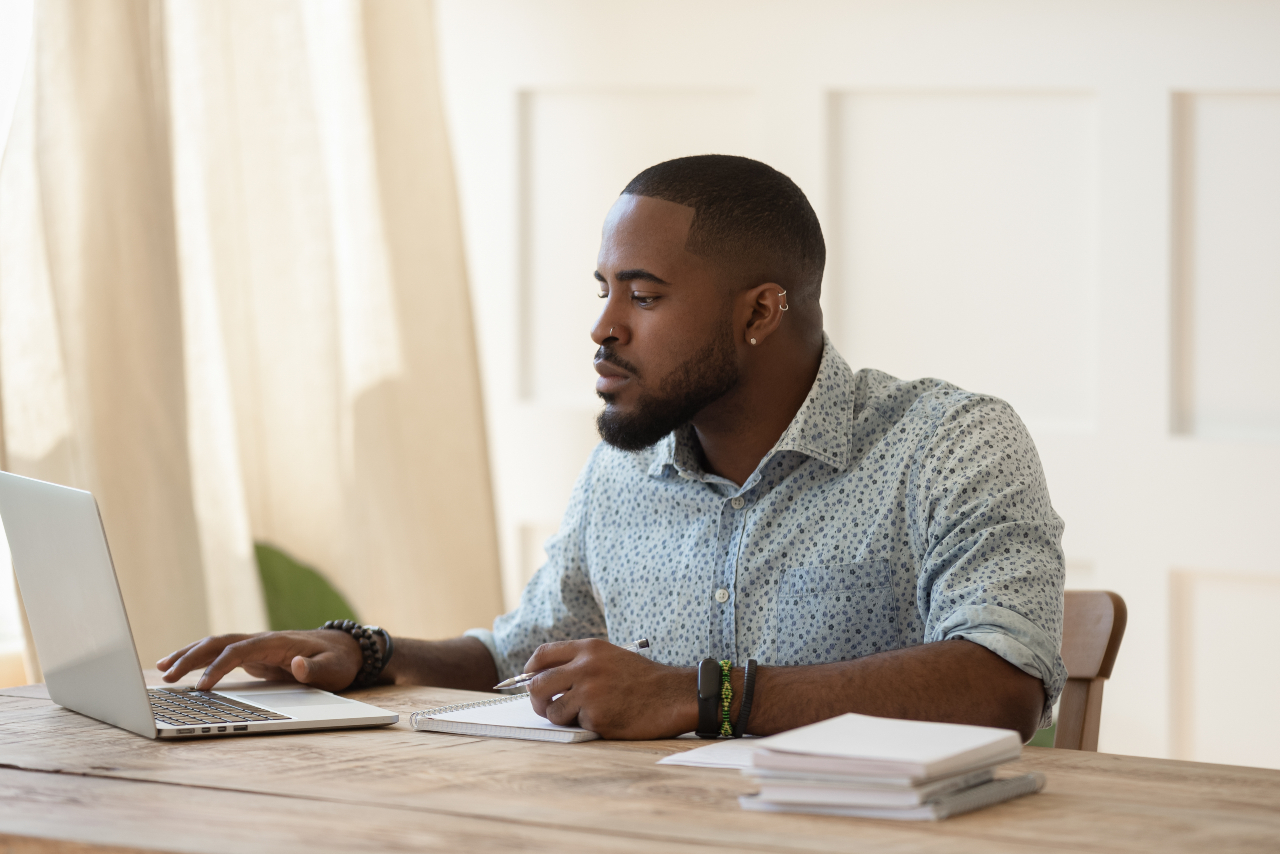 Man working at laptop on desk